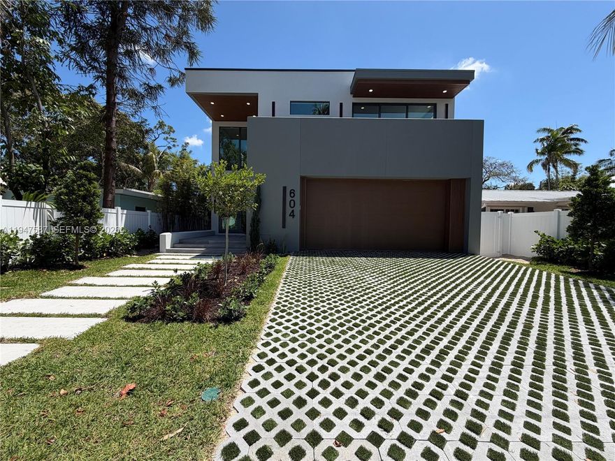 BRAND NEW 2026 ALL CONCRETE AND STEEL CONSTRUCTION- OPEN HOUSE WILL START ON MAY 2ND AND 3RD.  Showcasing elevated modern design built for strength, durability, and longevity. Enter through a dramatic double-height foyer highlighted by a glass staircase and designer accent walls. The main level offers a seamless open-concept layout with expansive living, dining, and kitchen spaces, plus a full guest bedroom with en-suite bath—ideal for guests or multi-generational living. Upstairs features three additional bedrooms, including a spacious primary suite, a versatile loft for an office or lounge, custom walk-in closets in every bedroom, and a generous walk-in pantry. Outdoors, enjoy a private saltwater heated pool and spa, BBQ area great for family gatherings and entertaining.  Located in Tarpon River, a highly desirable neighborhood just minutes from Downtown Fort Lauderdale, the beach, and the airport.