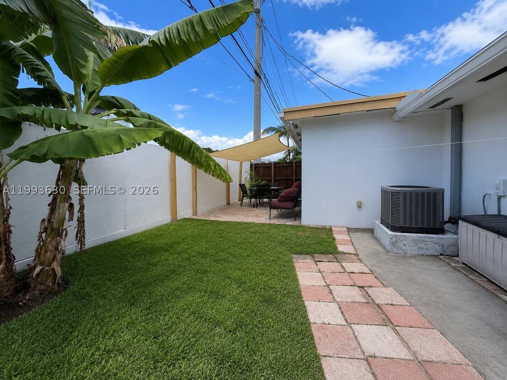 Photo of 1878 NW 45th Ct, Tamarac, FL 33309 (MLS # A11993630)