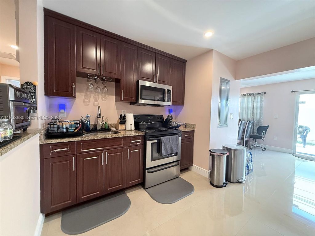Photo of 1878 NW 45th Ct, Tamarac, FL 33309 (MLS # A11993630)