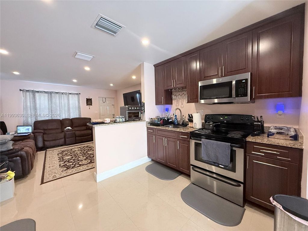 Photo of 1878 NW 45th Ct, Tamarac, FL 33309 (MLS # A11993630)