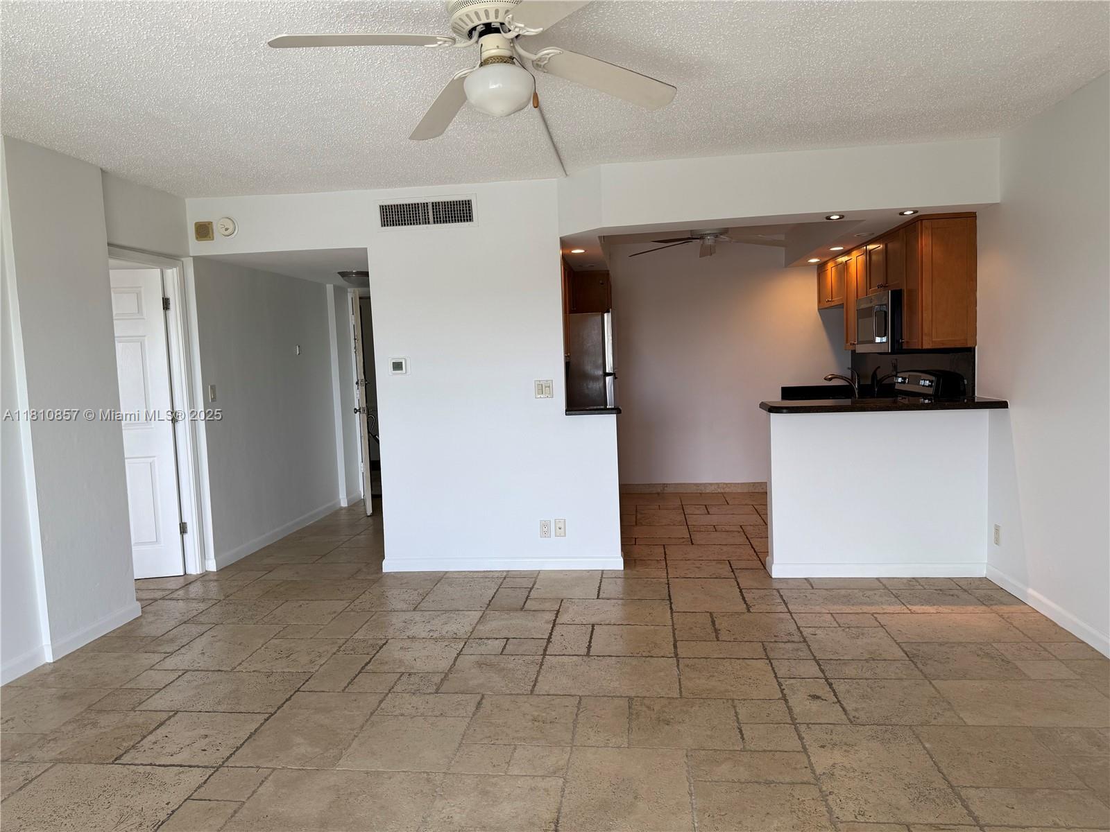 Great Price! Great Location! So close to the ocean you can smell the salt air. Lauderdale Tower Condo on 7th floor, one bed en suite, easy care travertine floor, open floor plan living room to spacious kitchen has newer finishes with warm wood cabinetry for storage, stainless appliances, recessed hi hat directional lighting, black granite counters with bar seating. Balcony off living room opens to western views for afternoon light. Front door entrance has a closet wall. Landlord leaving floor mirror in bedroom. Ceiling fans in great room, bedroom, kitchen. Verticals on slider door. Sorry, no pets for tenant. Credit score of 640 or higher. Pool and pool deck with bbq kitchen, bar, bike, kayak, scooter storage. New W/D equip. Gym. One parking space.