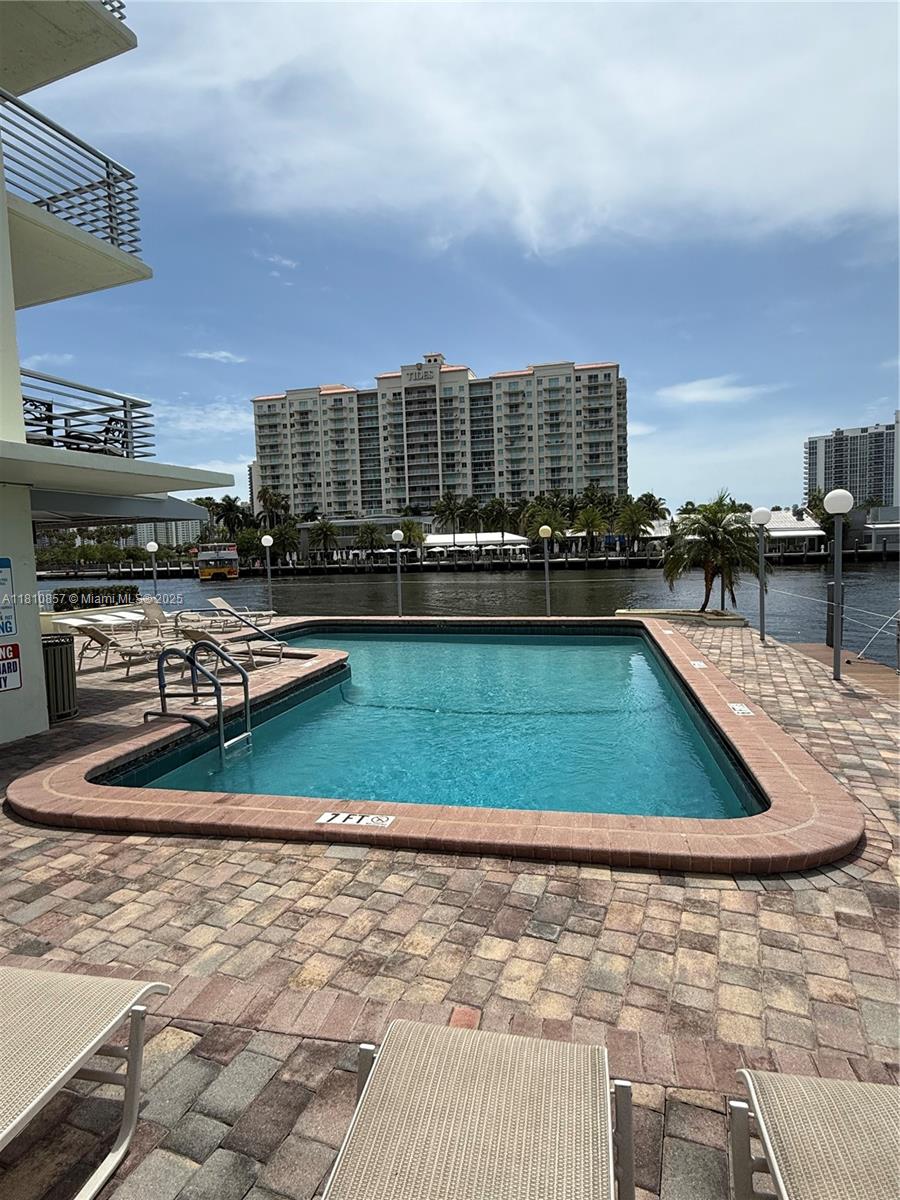 So close to the ocean you can smell the salt air. Lauderdale Tower Condo on 7th floor, one bed en suite, easy care travertine floor, open floor plan living room to spacious kitchen has newer finishes with warm wood cabinetry for storage, stainless Whirlpool appliances, recessed hi hat directional lighting, black granite counters with bar seating. Balcony off living room opens to western views for afternoon light. Front door entrance has a closet wall. Landlord leaving floor mirror in bedroom. Ceiling fans in great room, bedroom, kitchen. Verticals on slider door. Sorry, no pets for tenant. Credit score of 640 or higher. Pool and pool deck with bbq kitchen, bar, bike, kayak, scooter storage. New W/D equip. Gym. One parking space.