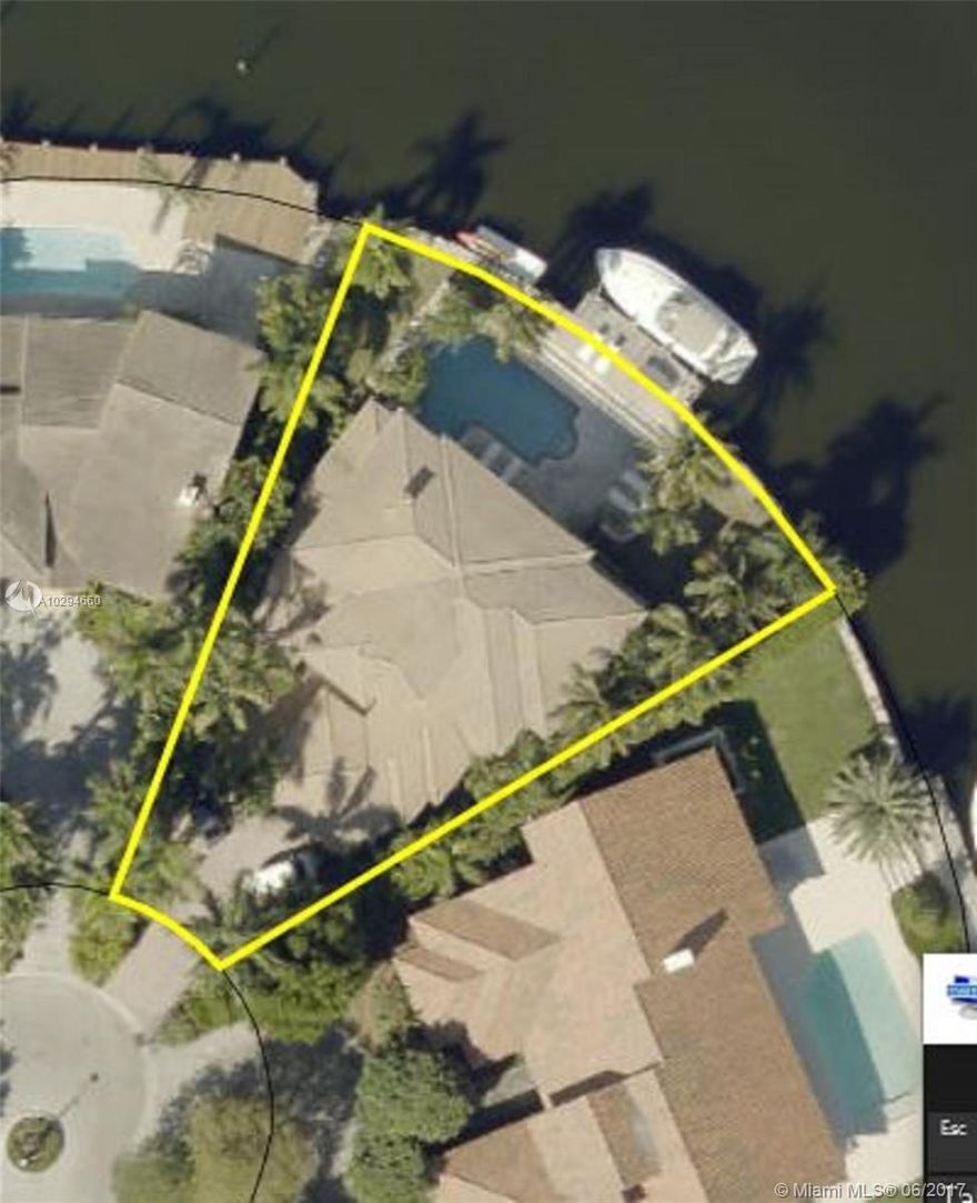 This 2 story modern home, on much coveted Center Island, is situated on a prime cul-de-sac location with 125' of enviable waterfront & intercoastal views. A state of the arts kitchen, with top of the line appliances opens up to an exceptional patio. The large master suite opens up to the beautiful pool area. Floor-to-ceiling impact doors and windows intimately connect this home to the water. There is a fully equipped dock and is gated for privacy. Truly a great family home.