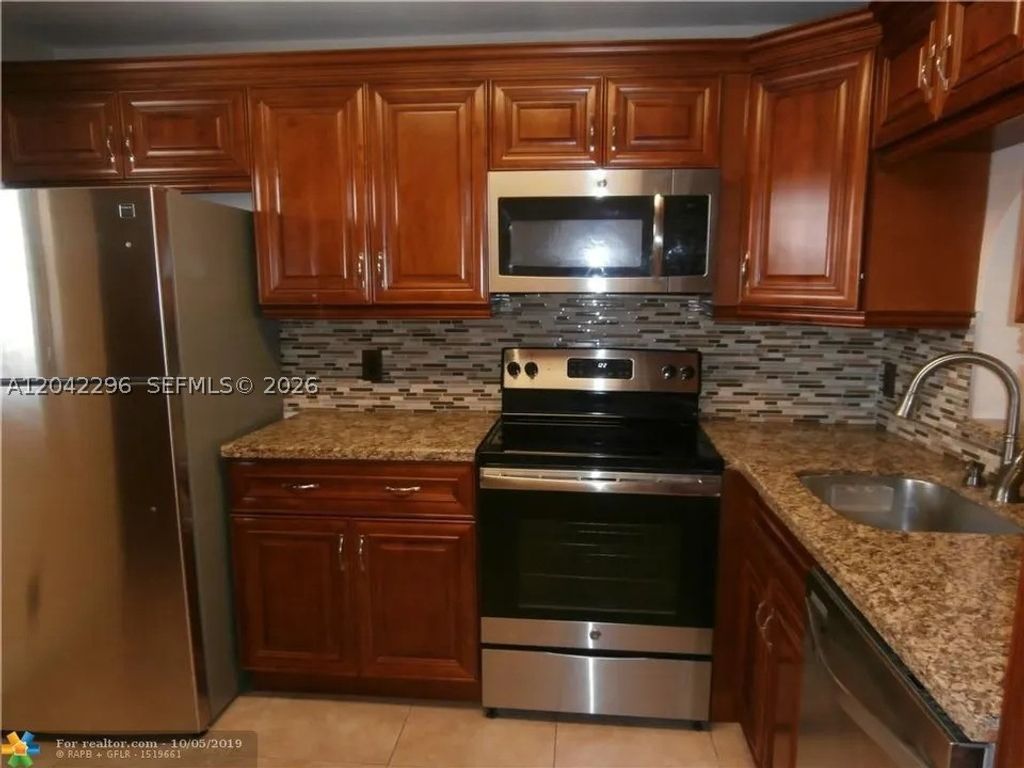 Photo of 7830 NW 33rd St #206, Davie, FL 33024 (MLS # A12042296)
