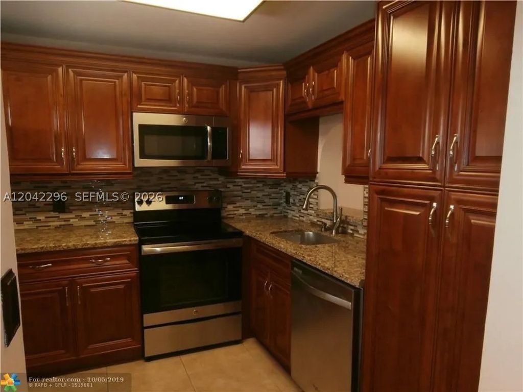 Photo of 7830 NW 33rd St #206, Davie, FL 33024 (MLS # A12042296)