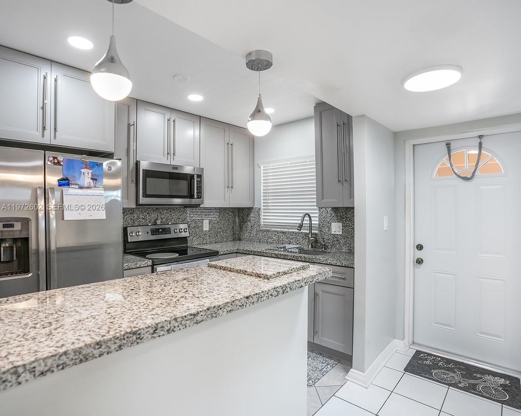 Photo of 9001 Sunrise Lakes Blvd #301, Sunrise, FL 33322 (MLS # A11972602)