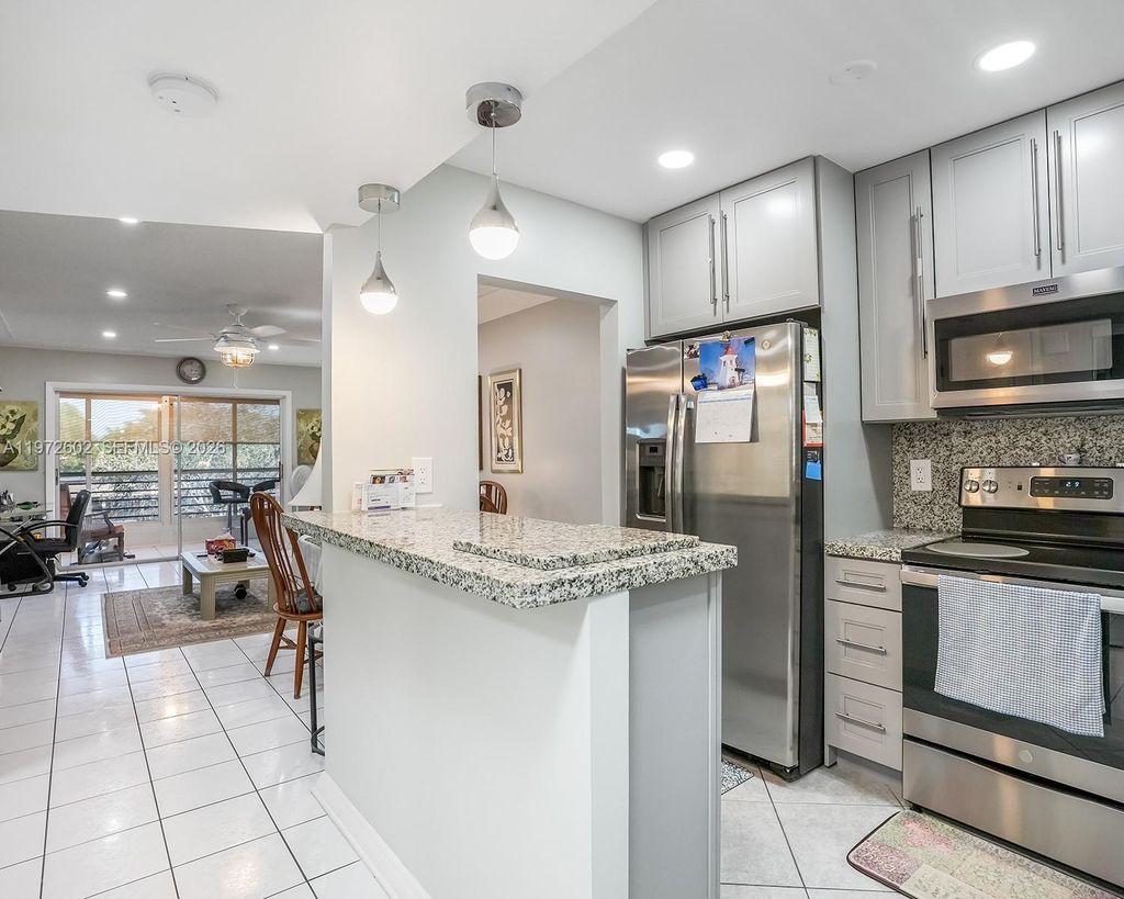 Photo of 9001 Sunrise Lakes Blvd #301, Sunrise, FL 33322 (MLS # A11972602)