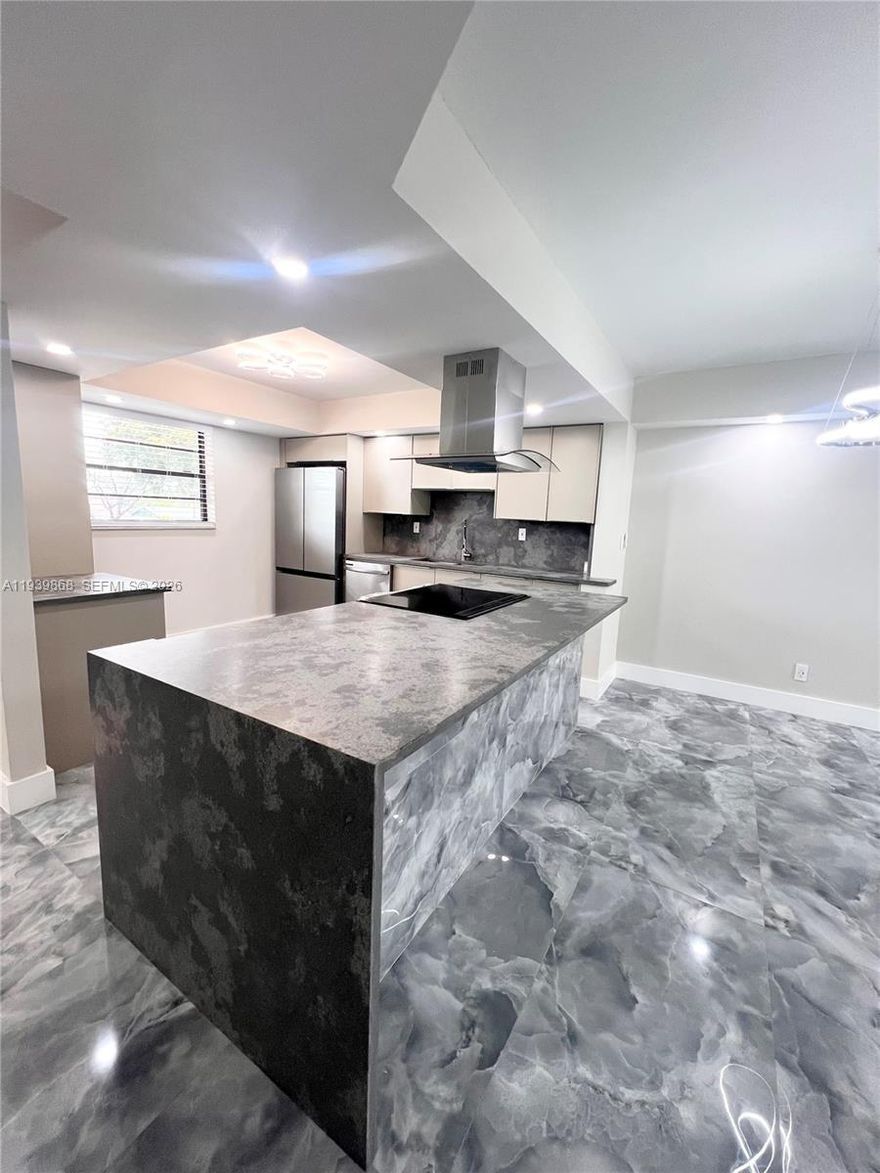 STUNNING HOME IN THE HEART OF TAMARAC. NEW ROOF NEW ELEVATOR ALL CERTIFICATIONS PASSED! 55+ CABLE INSURANCE AND INTERNET ARE INCLUDED. RETIRE IN STYLE. NEW STAINLESS STEEL APPLIANCES HAVE 2 YEAR WARRANTY. CUSTOM QUARTZ COUNTER TOPS WITH AN OPEN FLOOR PLAN AND COOKING ISLAND AWAIT ALL OF YOUR FABULOUS MEALS AND GATHERINGS. CUSTOM GORGEOUS TILE THROUGHOUT FRESHLY REMODELED HOME WITH FROSTED GLASS DOORS AS YOU WALK INTO EVERY AMAZINGLY LIT ROOM. SPACIOUS DEDICATED LAUNDRY ROOM WITH PLENTY OF STORAGE. SPA BATHROOMS WITH MODERN TOUCHES SUCH AS COLORFUL FUN WATER TEMPERATURE INDICATION! IT ALSO HAS BEAUTIFUL LAKE VIEWS. EVERYTHING IN THIS HOME IS SMART (LIKE IT'S FUTURE OWNER) FROM THE KITCHEN APPLIANCES TO THE LOCKS ON THE DOOR! THERE ARE SOME GREAT AMENITIES AS WELL PICKLE BALL GYM AND POOL!