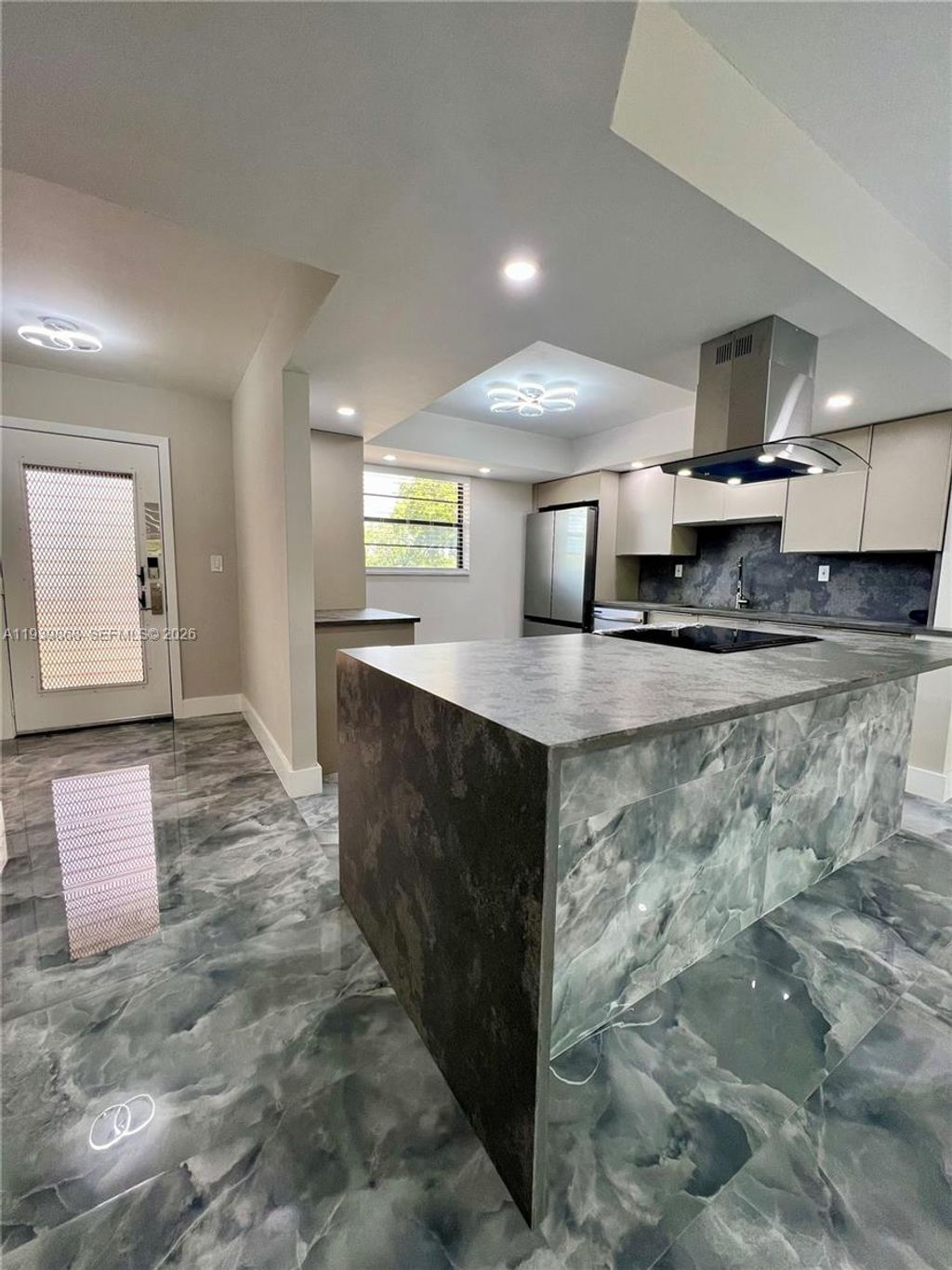 Photo of 4930 E Sabal Palm Blvd #206, Tamarac, FL 33319 (MLS # A11939868)