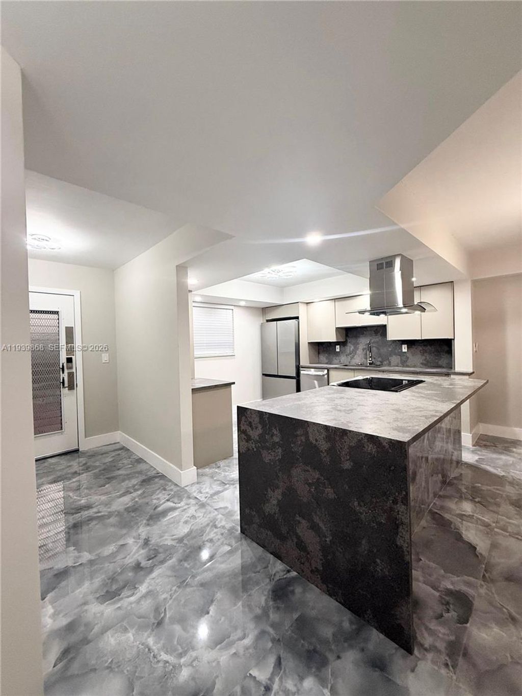 Photo of 4930 E Sabal Palm Blvd #206, Tamarac, FL 33319 (MLS # A11939868)