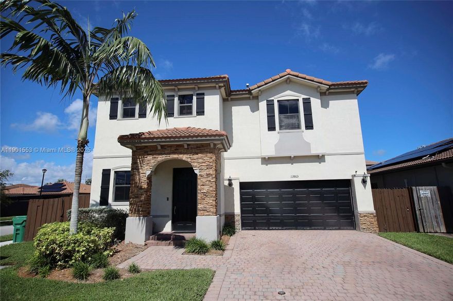 Welcome to this beautifully upgraded 5-bedroom, 3 bath corner-lot home in the desirable Silver Palms community. This residence offers a perfect blend of modern style, space, & functionality. The open layout features tile floors, spacious living & dining areas, & a stunning kitchen with ceiling-height cabinetry, quartz countertops, a waterfall island, SS appliances, a spice cabinet, plenty of storage, & a charming coffee bar. A private in-law suite on the 1st floor with a full cabana bath, ideal for guests or extended family. Upstairs, 4 bedrooms & 2 baths are complemented by elegant vinyl flooring, & a convenient laundry room. The primary suite includes a custom-built closet. The fenced backyard features an extended marble paved patio with lighting. The lot is large enough for a pool.