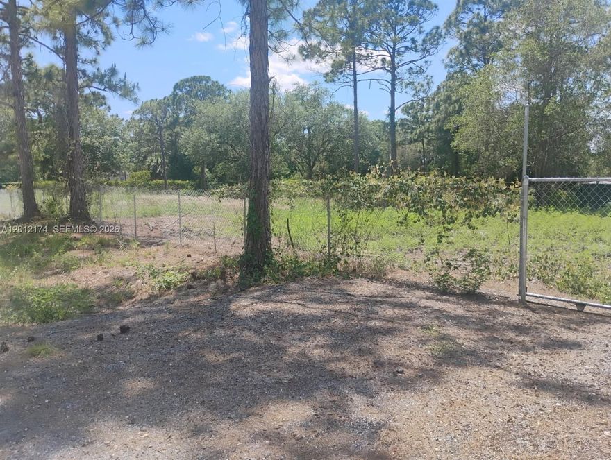 Nicely maintained lot with some trees, fully fenced in, and culvert (driveway). Slightly bigger than your standard lot size in this area at 1.33 Acres. Fence & Culvert are permitted and lot is ready to build or set your mobile home.