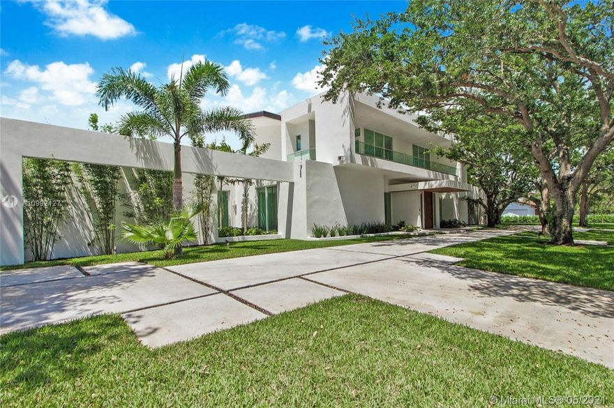Incomparable luxury at the crossroads of Coral Gables and Pinecrest. This brand new custom estate features flawless contemporary design from renowned architect, Giorgio Balli. The open-concept, 9,043 total SF interior boasts 7 bedrooms, 6 bathrooms, 2 half bathrooms, soaring 14'-high ceilings and impact-resistant windows, wood and Imported Italian marble floors, and custom Italkraft kitchen and baths. The ground level features an owner's suite, 2 guest suites, 2,200-bottle wine cellar, the finest contemporary finishes, Elan Smarthome System & ample storage. The outdoor spaces mimic the sleek & sophisticated design of the interior and offer a 44' saltwater pool, 300+ SF covered poolside terrace & summer kitchen...all on nearly an acre of lush grounds. Experience the new standard of luxury!