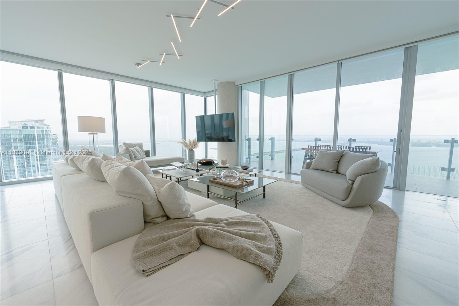 Completely furnished by Artefacto and professionally decorated condo featuring 3 bed + service room at Missoni Baia. Brand new construction boasting direct ocean views with floor to ceiling windows from every room. The gourmet kitchen, adorned with premium finishes, is equipped with state-of-the-art stainless steel appliances. The primary suite is a sanctuary of tranquility, featuring a king-sized bed and a private sitting area. Primary bathroom offers a spa-like oasis with luxurious amenities including separate shower and bath tub. Three additional bedrooms including staff bedroom provide comfortable accommodations with complete decorator furnishing. All rooms have black outs and shades. Fully equipped with smart home technology, outdoor designer furnished terrace, parking spaces included