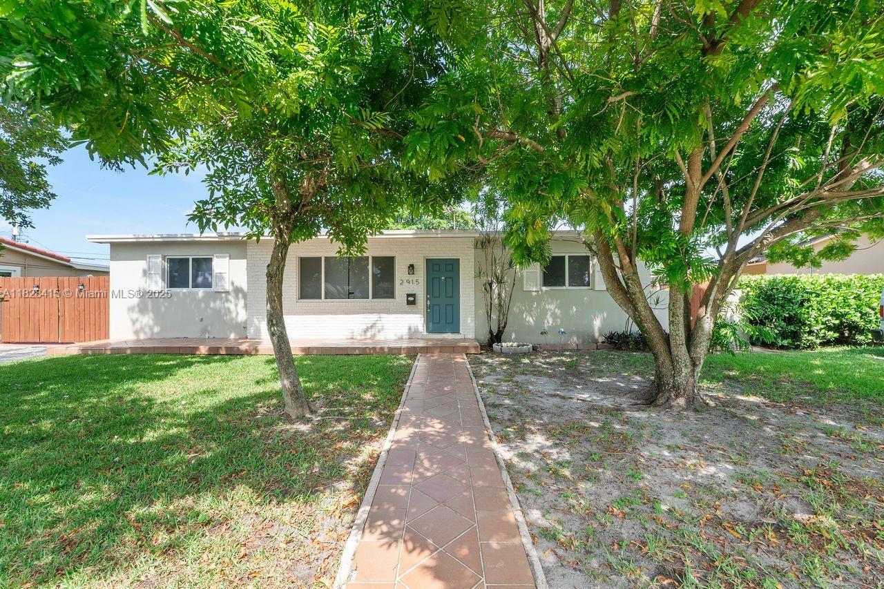 Welcome to this charming single-story home on a generous 7,700 SF lot with a concrete slab behind the wood gate—ideal for your RV or boat. Centrally located, this home offers timeless terrazzo floors, high-impact windows and doors, and a flat built-up roof (installed around 2007). Move-in ready with a new exterior central AC unit installed 6/25, a new evaporator coil (2021), and recent coil cleaning (2/24). Enjoy a comfortable split-bedroom layout with two baths—shower in the primary, tub in the guest. Includes refrigerator, electric range, washer, and dryer. Detached 117 SF CBS utility room has electric, and the fenced yard includes two sheds. City gas, water, and sewer. A beautiful sapote tree adds natural shade and charm. No HOA!