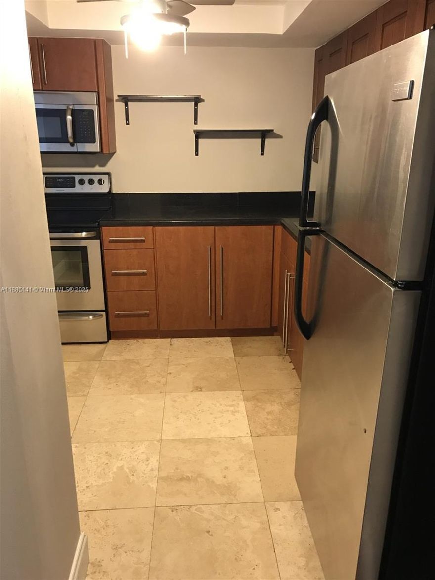 Investors Welcome! Currently rented $2,150.00/mo. with a lease until 04/2026. Nice 2 bedrooms 1 1/2 bathrooms. Building offers pool, tennis courts, one or more parking available on site, park across the street with kids play ground and basketball courts. Close to shopping malls, restaurants and beach. Maintenance includes water, trash, cable, internet and amenities. Building passed its 40-year recertification, association has full reserves.