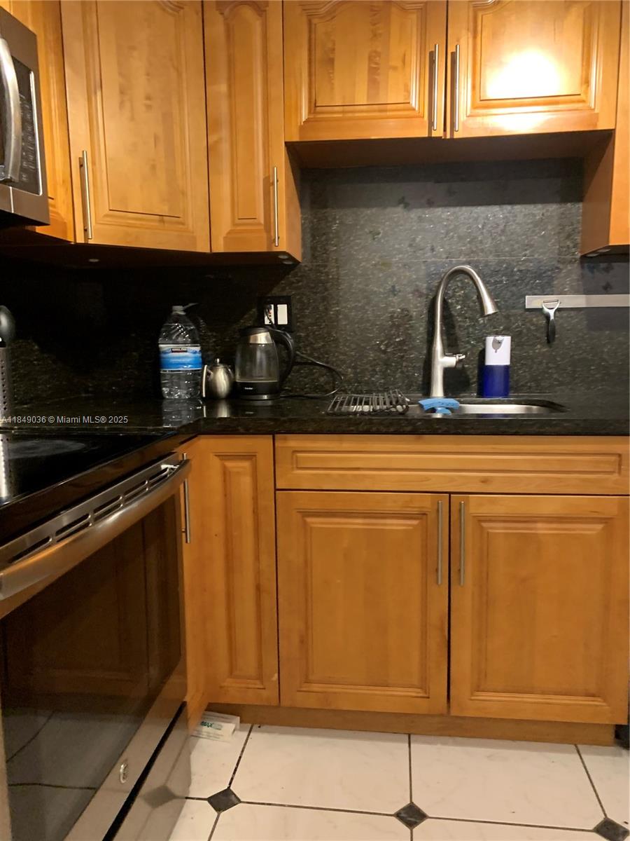 Live the prestigious Sunny Isles Beach lifestyle in this updated 2 bedroom, 2 bath directly across the street from Beach. Walk to shops, restaurants, parks. The residence features upgraded kitchen cabinets, granite counter tops, washer/dryer combo in unit, tile flooring throughout and new bathroom vanities. Easy to show contact listing agent for appointment. Tenant occupied until October 31st 2025.