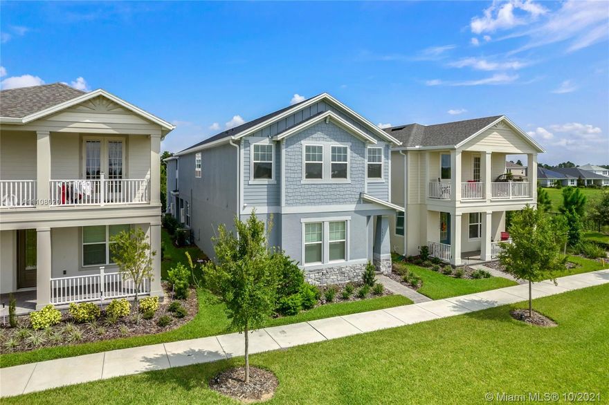 Embrace this captivating New Bladwin floorplan with over 2,921 sq. ft. of ample space to call home featuring 4 bedrooms + a private Studio above the detached 2 car garage, 4.5 baths, the first bedroom is located on the ground level,  The foyer entrance leads to the 24 ft high ceiling gathering room, and formal dining room. The gourmet kitchen comes with modern, updated cabinetry, GE Cafe appliances. Oakwood metal, spindled stairs, Masterbedrron, and secondary bedrooms are also located on the second floor along with a perfectly located laundry room. You don't have to miss out on the first floor. as you have access to view through a grandeur overlook. Enjoy the extended lanai with an added privacy fence to be installed. Steps away from the community club , pool and tot lot.