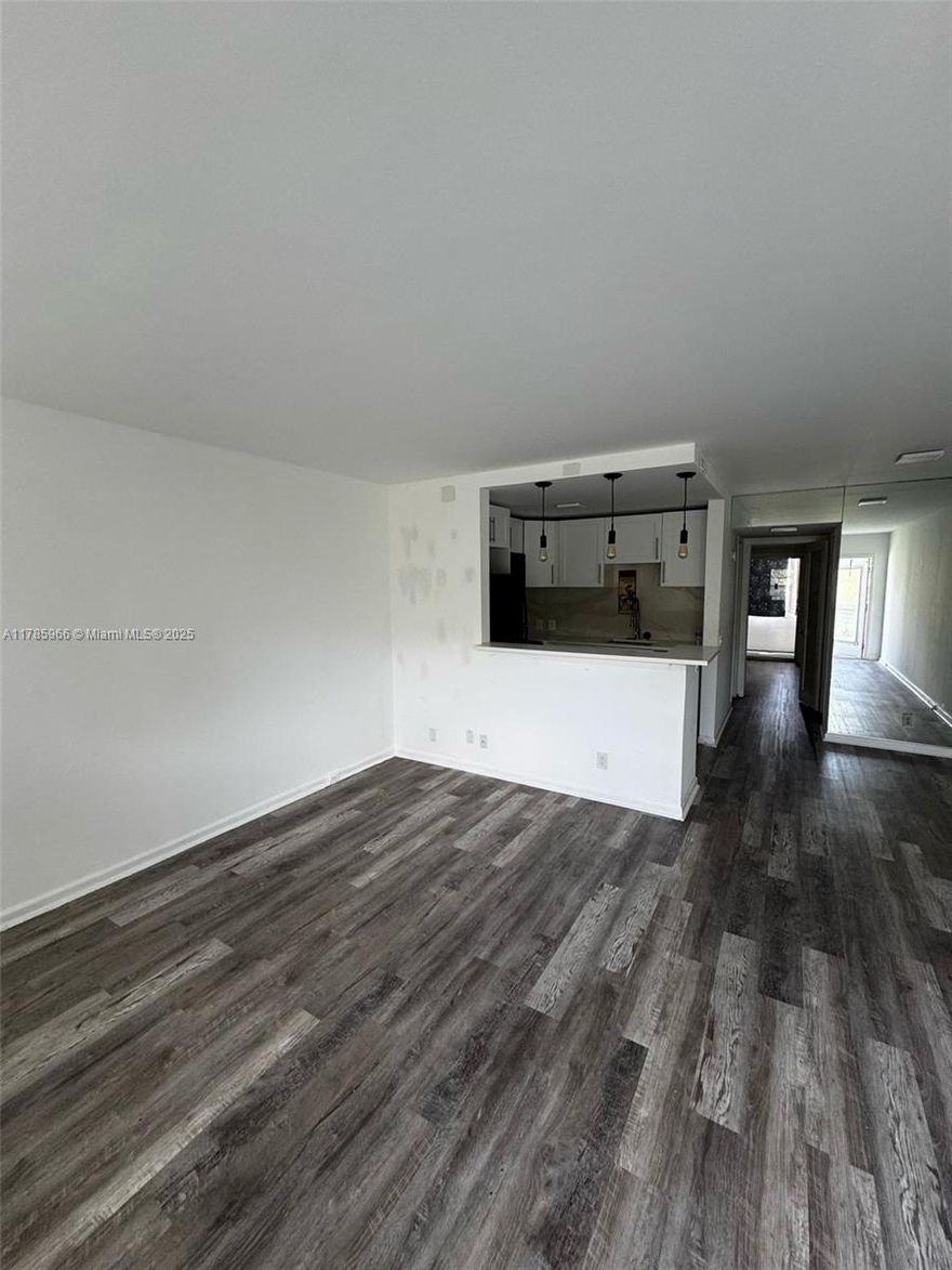 This apartment is in the desireable Suffolk Association of Century Village Boca Raton, a 55 plus community.Condo is a freshly painted in living room and has new floors in living room and bedroom. The lanai is enclosed.
