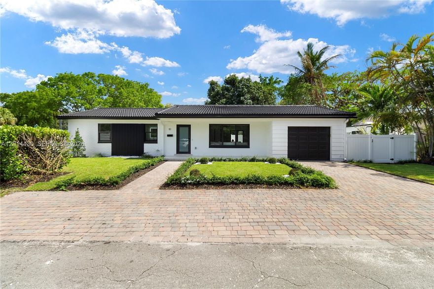 This stunning 3-bedroom, 2-bathroom residence has been renovated with no expense spared. Every major system is brand new — from the plumbing and electrical to hurricane-impact windows and doors, giving you peace of mind for years to come.
Step inside to discover an open, light-filled layout featuring luxury vinyl flooring throughout and a designer kitchen showcasing brand-new cabinetry, sleek new appliances, and elegant terrazzo countertops — a perfect blend of timeless Florida charm and modern sophistication.
The spacious primary suite offers a generous walk-in closet, while both bathrooms have been beautifully appointed from top to bottom. A one-car garage adds everyday convenience and storage.
Outside, the lush wrap-around yard is your private oasis — with ample space to add a pool, a safe play area for children or pets, and room to entertain under the Miami sky.
All of this in Miami Shores — one of Miami-Dade's most desirable and walkable villages, known for its tree-lined streets, A-rated schools, waterfront park, and vibrant community spirit.
This is turnkey, worry-free living at its finest. Just unpack and enjoy.