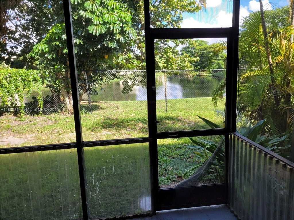 Photo of 4455 Treehouse Ln #A, Tamarac, FL 33319 (MLS # A11866364)