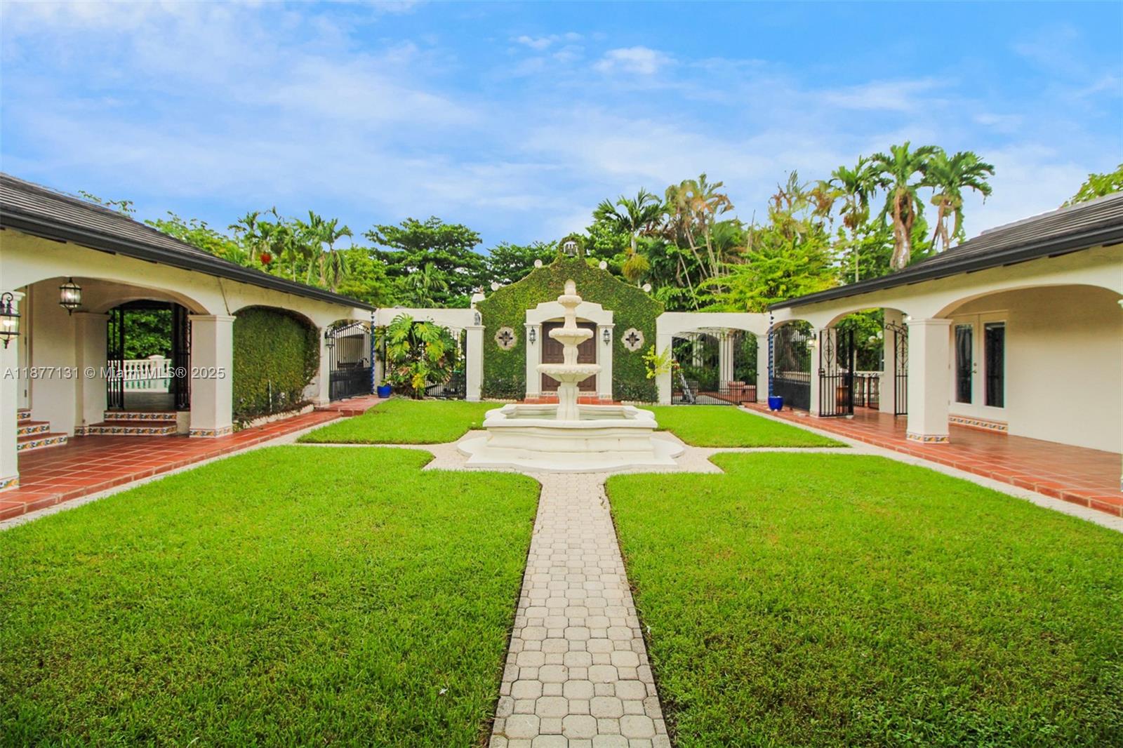 This elegant estate blending comfort & functionality is a true Horse Country gem. Featuring a 2023 tile roof, impact windows, doors & garage, it offers peace of mind with curb appeal. Inside, the remodeled gourmet kitchen boasts a NEW gas stove & HOOD, under cabinet Microwave with wine cooler and Ice maker, double oven & premium finishes ideal for entertaining. Brand new Bar with 165 bottle capacity cooler & separate Humidor. The resort-style backyard showcases a sparkling pool with new heater, gazebo, wet bar & boat parking. Extras include a 12 camera security system, alarm, 3 tankless water heaters, 3 newer A/C units, LED lighting & Private in-law quarters with separate entrance & garden provide comfort for guests, while a chapel offers space for events or conversion into a guest house.