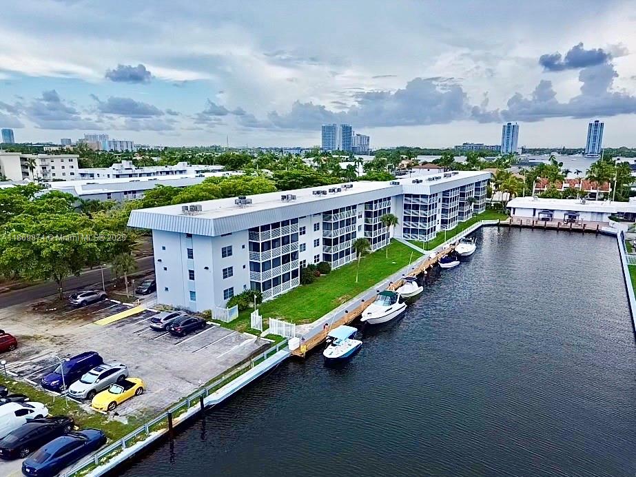 Boat-lover's retreat in ultra-quiet 55+ Eden Isles, canal-front minutes to the ocean. Bright 1BR first-floor garden home with screened balcony facing the Canal and private docks. Elegant new kitchen with wood cabinetry, granite, Bosch dishwasher and a brand-new convection oven/microwave; custom closets, updated High Impact doors and lighting. 2025 A/C with transferable warranty; impact entry (per owner). HOA includes cable, internet and water. Heated pool, clubhouse, gym, billiards and community shuttle. Dockage to rent or buy – bring your boat! Surrounded by ultra-luxury homes and towers with private docks, including Williams Island, Acqualina and the future Intracoastal/Uptown Harbour. 3-D Virtual Tour & floor plan available – call listing agent.