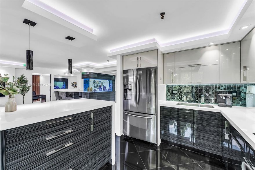 Step into this completely renovated, partially furnished 2BD/2BA modern gem where every detail has been thoughtfully curated. From the sleek kitchen with stainless steel appliances to the serene primary suite with blackout shades and a California walk-in closet, this home radiates comfort and style. Enclosed balcony adds versatile space. Enjoy LED soffit lighting, sound system in the walls, hurricane-impact windows, and a 180-gallon fish tank. Remote shades, designer finishes, a rare find!  Steps from Aventura Mall, fine dining, Brightline & I-95.