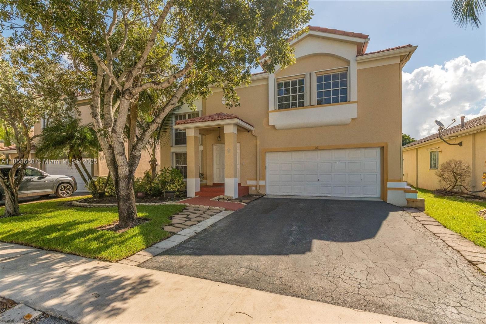 Beautiful Gem in Weston... Two-story home in the highly sought-after community of The Gables. This amazing five-bedroom, four-bath lakefront home is ready for new owners! The home just received a new plumbing upgrade ($25K), has been freshly painted, popcorn removed from the first floor, with living/dining areas featuring remote shades and high ceilings. The first floor bedroom, stairs, and second floor have wood floors. The house includes a built-in generator that can power the entire house during an outage and accordion shutters throughout. Enjoy the stunning covered and screened patio overlooking peaceful lake views. Neutral finishes throughout, house and fence freshly painted, roof just cleaned—it's a must-see! Amazing schools and friendly neighborhood!
