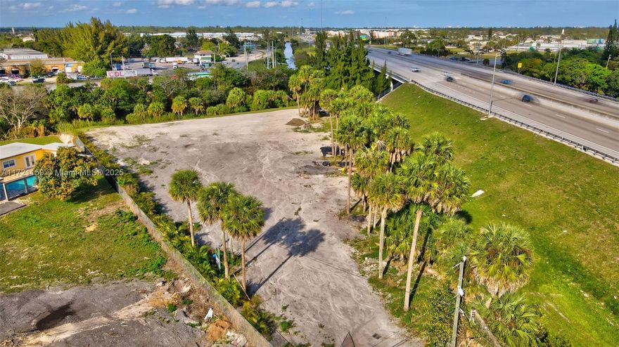 This is a partially fenced in 1 acre lot where someone may build their dream and have a plant nursery, small farm, flower or another agriculture use. Zoning is "AR—AGRICULTURAL RESIDENTIAL" according to Palm Beach Appraiser website. Confirm your potential plans with the county before making an offer. It does have electrical outlets (200 amp panel) and a small well (currently inoperable). There is also access to water via a canal. The location is amazing and only 5 minutes to a lot of shopping and various types stores, It is 15 minutes from PBI airport and 25 minutes from beach. SELLER FINANCING available