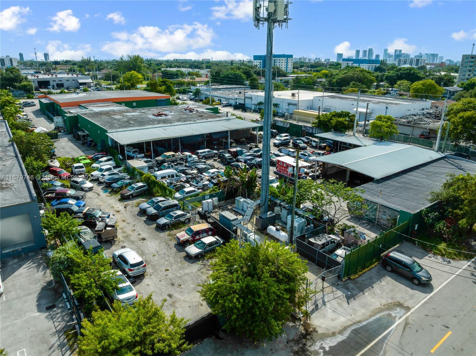 Located at 7115 NW 10th Ave in Miami, this prime industrial property presents an outstanding opportunity for investors or owner-users. Spanning a generous 34,000 square feet, it includes 2,763 square feet of adaptable office or living space and is zoned for 7100 Industrial use. Currently configured for car storage, the facility boasts 6 lift bays, a fully fenced perimeter, and multiple entry points, ensuring both enhanced security and operational efficiency. Ideally positioned just off I-95, this property offers excellent connectivity to major transportation routes, making it an optimal choice for industrial, manufacturing, or warehousing needs.