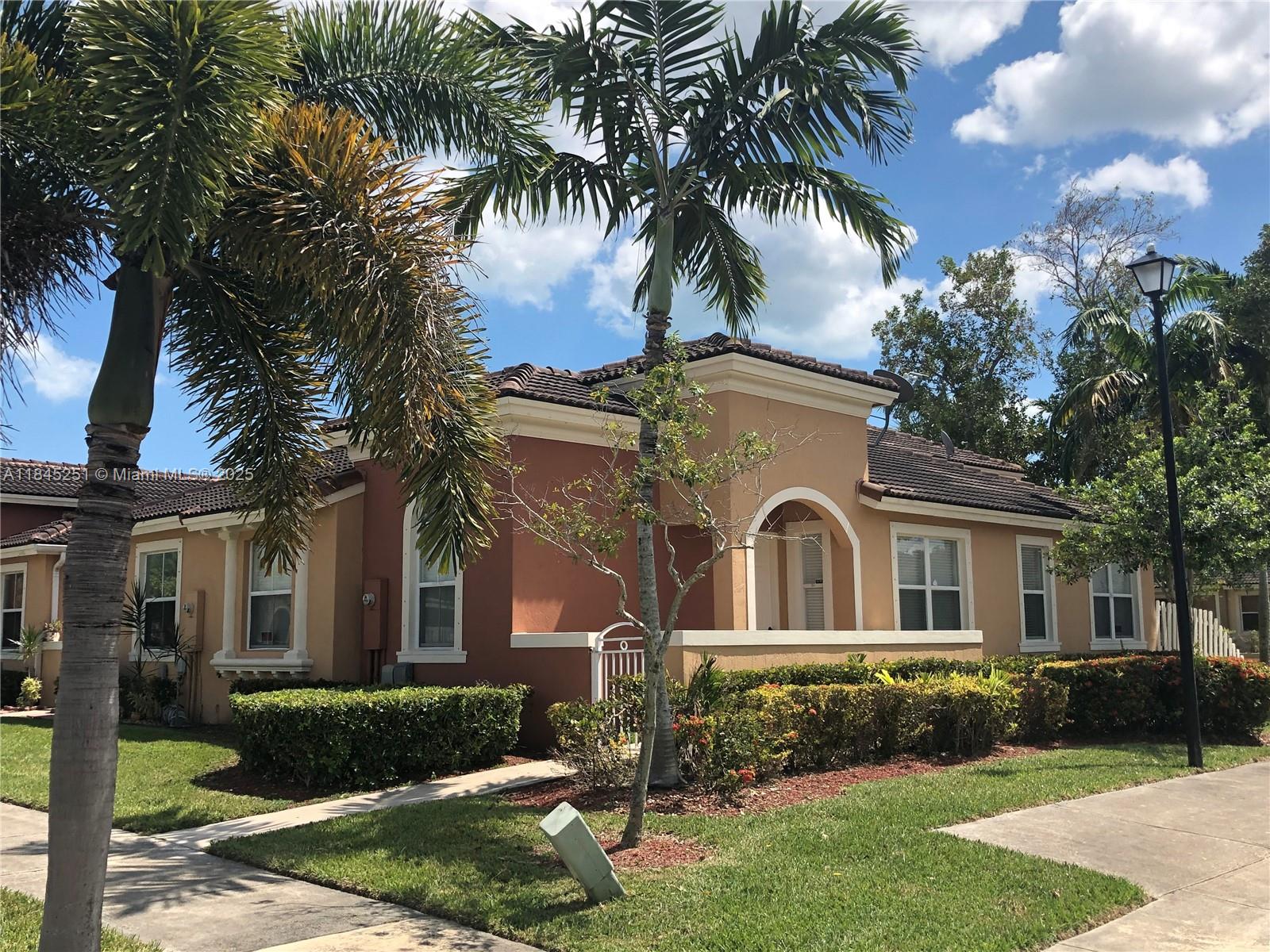 Pristine community: Very spacious corner 3 bedroom, 2 bath one-story townhome. Tiled floors, fenced back patio, laundry room, 2+ parking spaces, kids park. Ready to move in. Close to Publix, schools, restaurant and more.