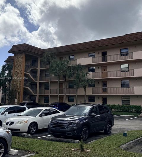 Photo of 4940 E Sabal Palm Blvd #203, Tamarac, FL 33319 (MLS # A11977407)