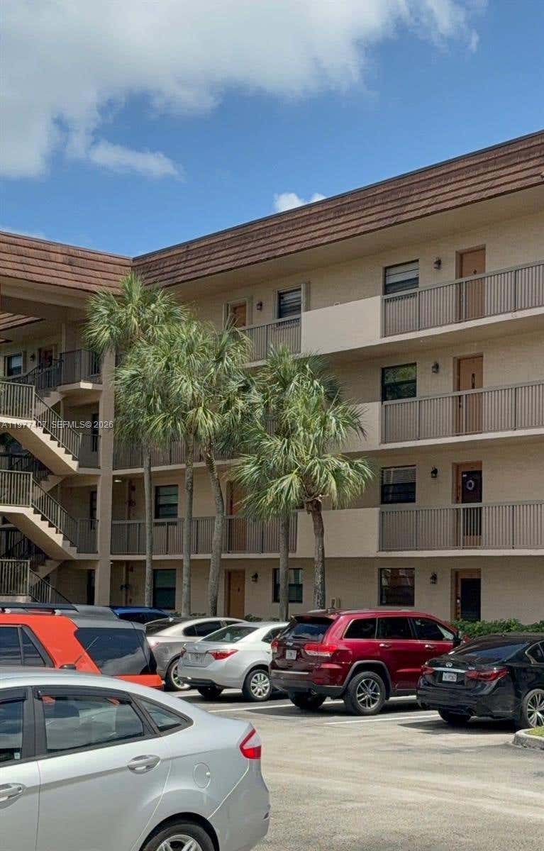 Photo of 4940 E Sabal Palm Blvd #203, Tamarac, FL 33319 (MLS # A11977407)