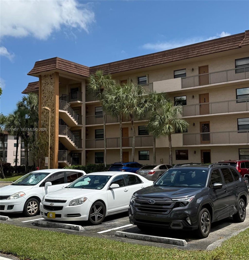Photo of 4940 E Sabal Palm Blvd #203, Tamarac, FL 33319 (MLS # A11977407)