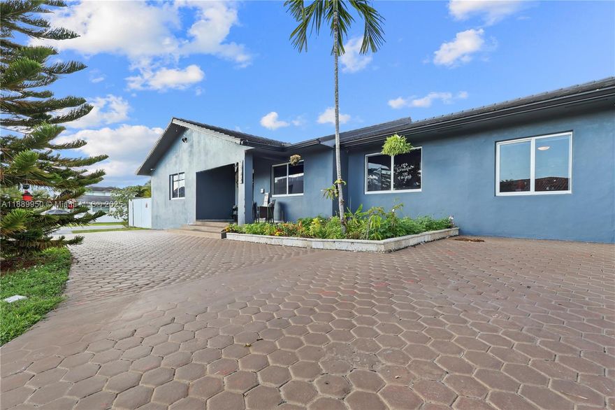 Stunningly renovated 4BD/4BA corner single-family home in a very desirable neighborhood in El Doral area. Features two spacious master suites—perfect for families or multi-generational living. Entire home upgraded with 24x48 porcelain tiles, new electrical system w/Cat6 wiring, motion lighting & smart features. Luxury spa bath with 6x6 glass steam shower, 4 shower heads, Bluetooth lights & speakers. Two new AC units. Resort-style backyard with 34x15 saltwater pool, jacuzzi, hot tub & 30x12 covered terrace. New septic, impact windows & POE video surveillance, feels brand new! ***NO ASSOCIATION FEES***