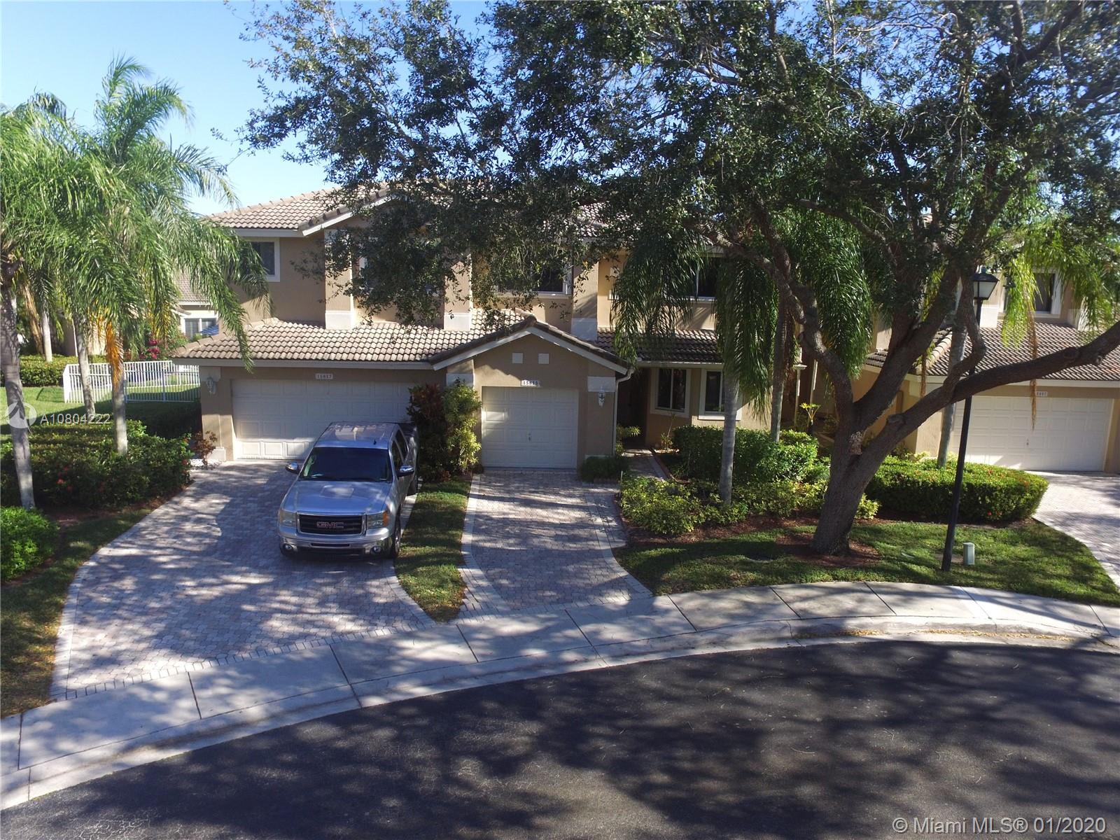PRICED TO SELL! The original owners have maintained this unit but it is time for remodeling if buyer chooses to do so. Beautiful townhome community within Grand Palms located in a cul-de-sac with an oversized property compared to others! Master suite is located on the first floor with a walk in closet. The other 2 bedrooms are located on the upper floor. Home has a laundry closet with a full size washer and dryer. Enter this unit and notice all the natural light, large eat in kitchen with white cabinets & nice size living/dining room area. The large roof patio area is delightful and great for family gatherings. Community pool walking distance from unit. Manned gated entry, plenty of green area throughout the 27 hole golf course community.