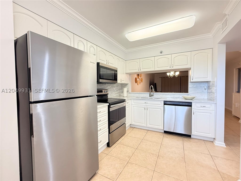 Photo of 2206 S Cypress Bend Dr #508, Pompano Beach, FL 33069 (MLS # A12049931)