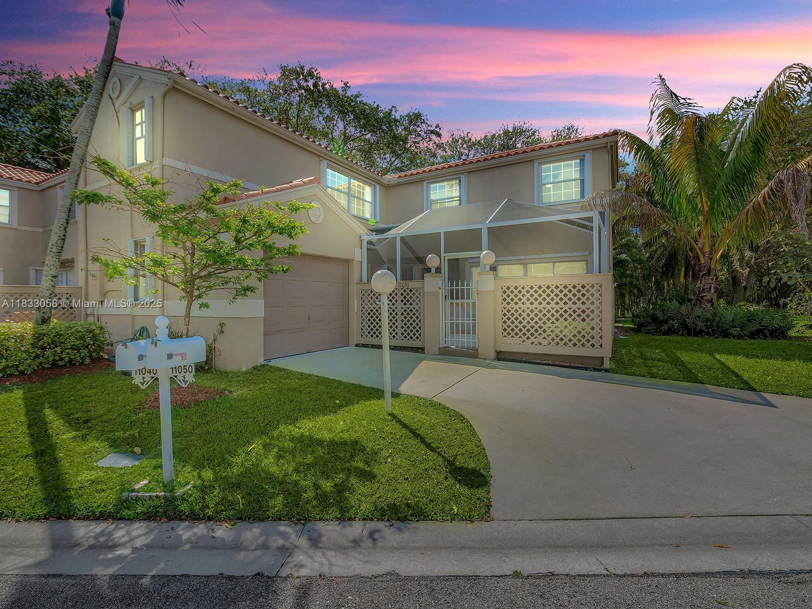 Welcome to this spacious home in the highly desirable gated community of Embassy Courts. Featuring tile floors throughout the main level and wood-look laminate upstairs, this well-maintained property offers an open eat-in kitchen with passthrough bar, a dedicated dining area, and a large living/family room, perfect for entertaining. Enjoy the convenience of a first-floor half bath and laundry area. Sliding glass doors lead to a charming screened front courtyard and a private garden in the back. The oversized primary suite offers abundant natural light, a large walk-in closet, and serene views of the courtyard. Centrally located near top-rated schools, major highways, shopping, dining, and parks.