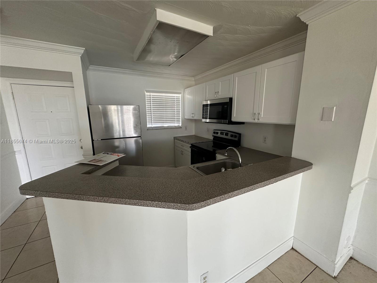 Welcome to your new home in this beautifully maintained gated community. This 2-bedroom, 2-bathroom apartment is ready to move in and features all tile floors, central AC, and a washer and dryer in the unit. Enjoy the convenience of water included in your rent and the security of 24/7 security at the gate. The community pool is perfect for relaxing after a long day. Located close to major avenues and Turnpike, shopping and schools, this apartment is in a prime location. With FAST APPROVAL (under 5 days), you can move in quickly and start enjoying your new home. Don't miss out on this opportunity - schedule a viewing today!