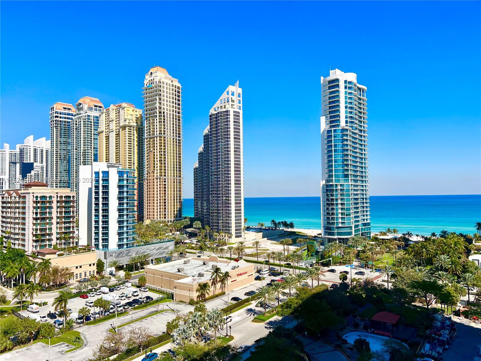 Winston Towers 600, 2/2 corner unit has floor to ceiling windows, wrap around balcony with panoramic view of Sunny Isles Beach and Atlantic Ocean. Updated kitchen, wooden flooring. Washer/dryer in the apartment. Location is the key - steps from the beach, parks, restaurants, shops. Moving to Florida? Check this one! 1 parking space and if you need 2nd let us know, monthly fee may apply.