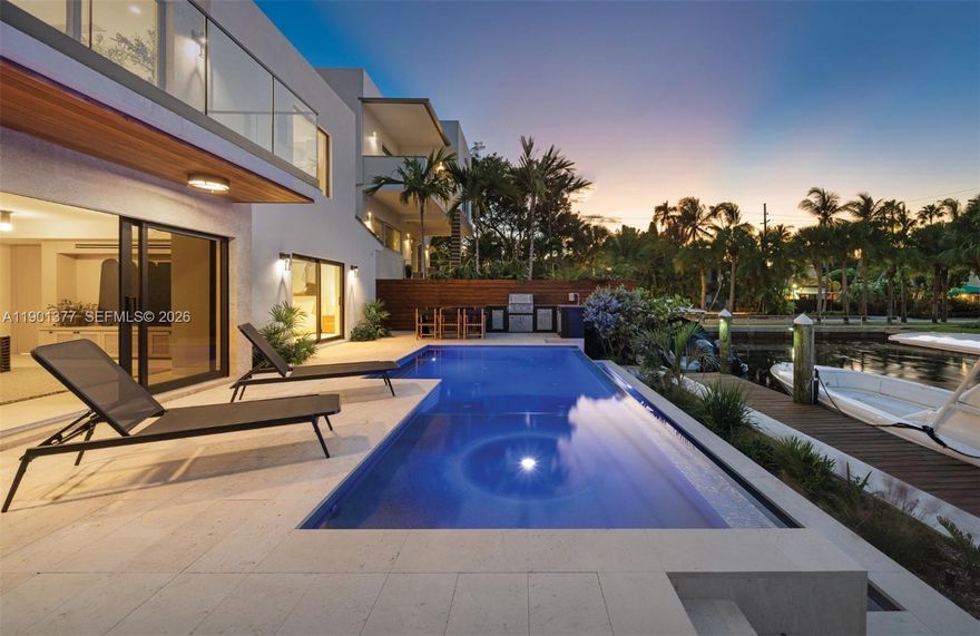 A Modern Boater’s Paradise — This exceptional waterfront residence in Coconut Grove seamlessly blends architectural elegance with contemporary comfort. Completely reimagined, the 4BR/4BA home features Italian porcelain flooring, white oak finishes, bespoke millwork, and Lutron lighting throughout. The chef’s kitchen is a showpiece with Sub-Zero and Wolf appliances, a built-in coffee system, Grand Viola marble countertops, and custom cabinetry. Thoughtful upgrades include a new roof, new impact windows and doors, and new electrical, ACs and plumbing. Outdoors, lush tropical landscaping, a sparkling new pool, summer kitchen, and integrated sound system frame 50 feet of private dockage offering direct, unobstructed bay access. Excellent location close to Brickell and Center Grove.