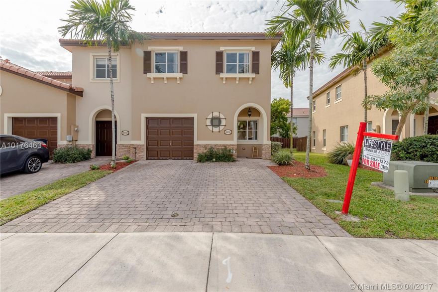 Immaculate 3 bedroom 2 bathroom townhome in gated community with amenities ranging from gym, playground, Olympic size pool, amazing club house, low association cost, 24 hour security guard, plenty of guest parking, massive lake with fish. The property has tile throughout, hard wood floors on the stairs, washer and dryer upstairs, aluminum hurricane shutters, large bedrooms, open floor plan kitchen to family room, appliance all less than 2 years old...A true must see!