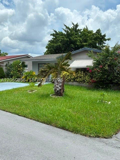 Photo of 7311 NW 57th Dr, Tamarac, FL 33321 (MLS # A12060856)