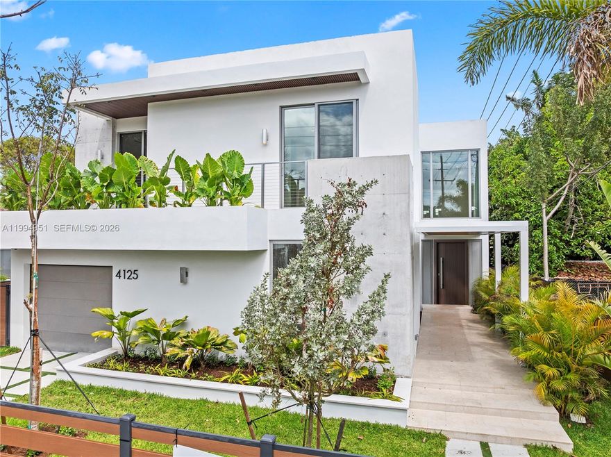 Welcome to OWN Development’s Mega Home, presented by The Azar Team. This exceptional new construction two-story residence offers 4,328 square feet under air and a total of 5,256 square feet of thoughtfully designed living space. Blending modern architecture with functional elegance, the home features 4 bedrooms, a home office, and 4.5 bathrooms, including a full bedroom and bath on the first floor, ideal for guests. A dramatic foyer sets the tone upon entry, leading into an open-concept layout with high ceilings in the main living areas. The seamless flow between the living room, family room, and kitchen creates a bright and inviting atmosphere, enhanced by recessed lighting. Additional flexible spaces include an open den on the first floor and a second den upstairs. The centrally positioned kitchen features Taj Mahal quartzite countertops and backsplash, Thermador appliances, a walk-in pantry, and a clean, modern design. Upstairs, the primary suite offers a private retreat with an en-suite bathroom, while the remaining bedrooms are well-proportioned. Engineered hardwood flooring runs throughout the second floor, adding warmth and a refined finish. The outdoor space is designed for entertaining, featuring a private pool with a heater and salt chlorination system, covered patio, and landscaped yard. The home is fully fenced and includes an automatic gate, CCTV, and surround sound. A balanced layout in prime Miami, close proximity to the Design District.