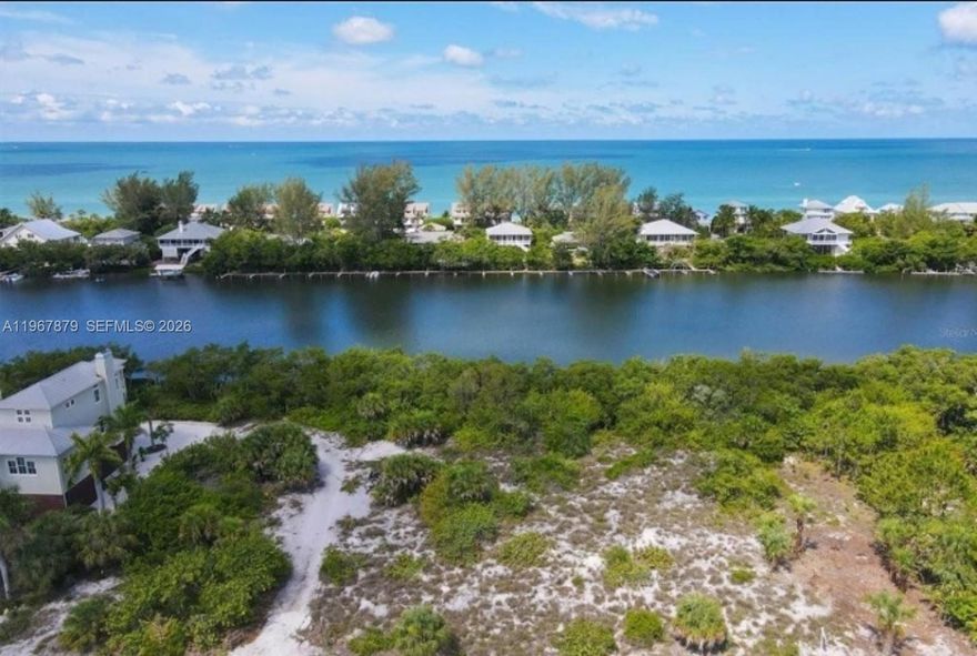 Rare opportunity to acquire a prime waterfront canal lot on exclusive Palm Island, offered with custom architectural plans and permit-ready package for the signature Angra Beach House luxury residence.

This 7,500 sq ft (0.17 acre) homesite features approximately 50 feet of water frontage with direct boating access to the Intracoastal Waterway and Gulf of Mexico. Located within Palm Island Estates, a private barrier-island community accessible only by ferry or private boat, the property offers exceptional privacy, coastal lifestyle, and strong vacation-rental potential.

The sale includes a complete ready-to-build architectural design tailored for elevated coastal construction, maximizing water views, indoor-outdoor living, and resort-style amenities including pool and outdoor living areas. Substantial development work has already been completed, providing significant time and cost savings to the purchaser.

Palm Island is known for secluded beaches, boating lifestyle, and distinctive waterfront residences along Florida’s Gulf Coast. Ideal for builders, investors, or end users seeking to create a signature island home in a unique coastal setting.
