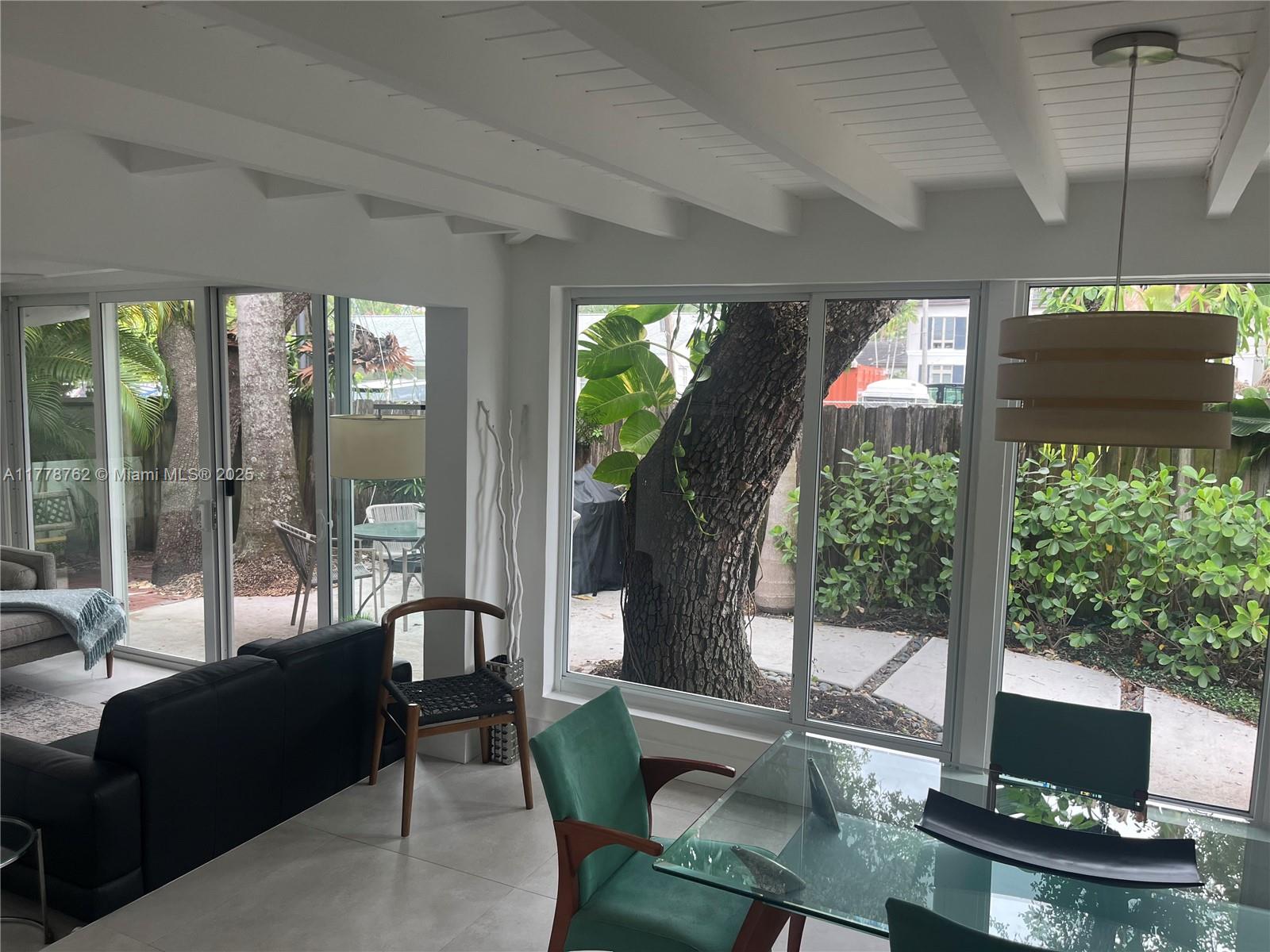 Beautiful furnished home recently renovated immerse in nature. Interesting design with lots of light. 3 bedrooms 2 bath and additional separate office. Open Kitchen facing one of the two living areas. The second living room area is connected with dining room accentuated by ceiling wood beams and large floor to ceiling sliding impact windows. Location location location.......Centrally located near Las Olas Blvd Airport/Seaport Also near Brightline Train to WPB and Miami, downtown and the beautiful beaches. Property all fenced in and private. For boaters there is no fixed bridges. Across deep water canal.