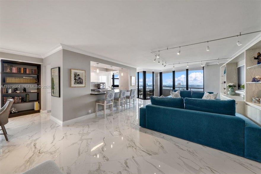 Rare opportunity to own the only 3 bedroom, south facing penthouse in all of Quayside. This fully renovated 3BR/2.5BA residence features custom built-ins, a chef’s kitchen, and a wraparound balcony with unobstructed Intracoastal, Biscayne Bay, and Miami skyline views from every room. Enjoy breathtaking sunsets in a truly one of a kind home. Set within the prestigious,  gated 34- acre Quayside community. Residents enjoy a resort-style lifestyle surrounded by lush landscaping, tranquil walking paths, and cascading waterfalls. Amenities includes eight tennis courts, a state of the art fitness center, heated pools, sauna and spa, as well as two on site dining venues.