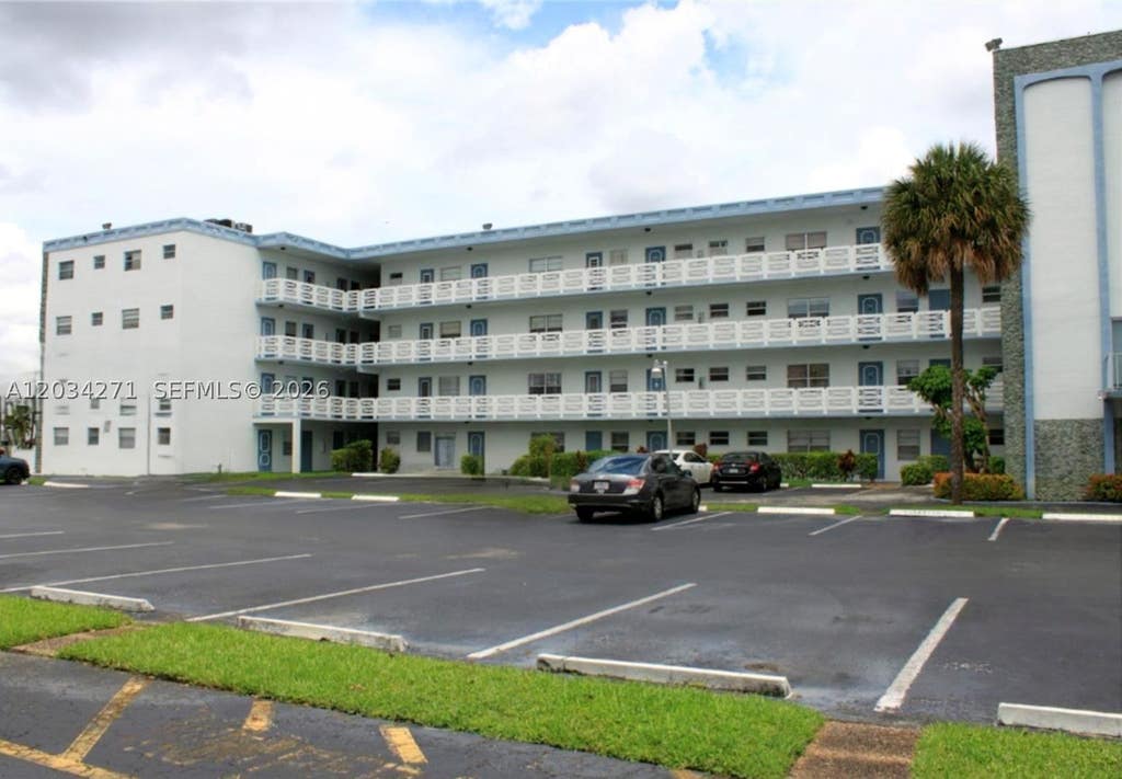 Photo of 4090 NW 42nd Ave #304, Lauderdale Lakes, FL 33319 (MLS # A12034271)