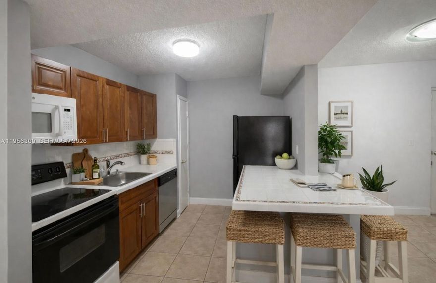 Investor’s Opportunity in Prime West Miami Location!
Ground-floor 2-bed, 1-bath  Townhouse in highly sought-after University Trail community. Just minutes from FIU, major highways, Dolphin Mall, and abundant rental demand. Features include a functional layout, private patio, and low HOA fees—ideal for steady cash flow. Unit is currently vacant and ready to rent or renovate for maximum return. Strong rental potential in ZIP 33184. Don’t miss out!